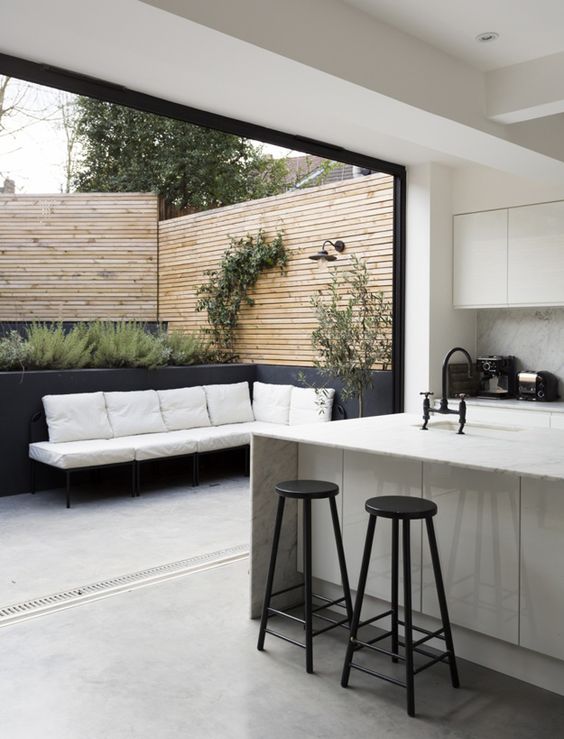 Simplicity and refinement - desire to inspire - white, black and marble kitchen with bi-fold doors