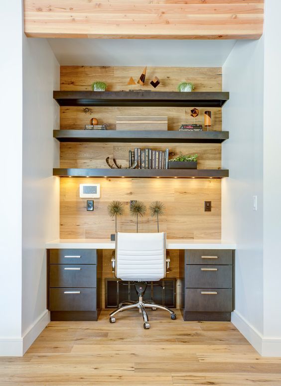 Small office space with built in desk, wood wall, white leather office chair and wood shelving | BLACKBOX design studios