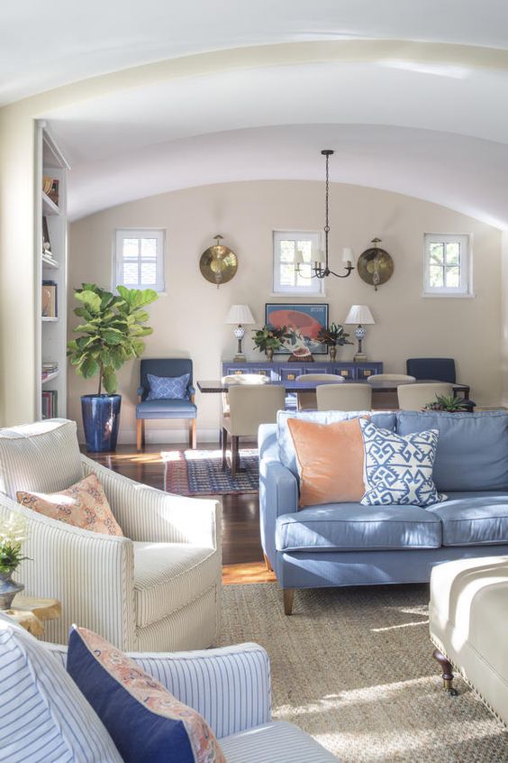 The living room and dining room were treated as a single space, using a strong color palette to tie it together