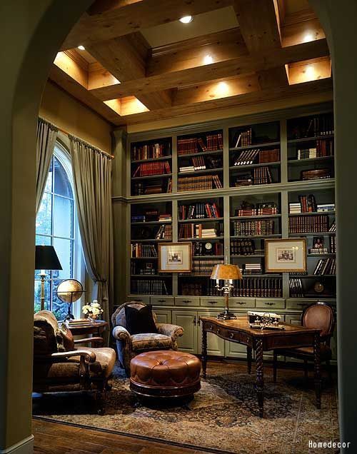 The man cave for guys who like to kick back and relax with some scotch and a good book. Click to see the right way to style a bookshelf.