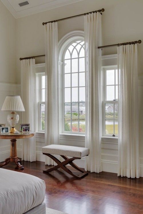 These staggered sheers are a great way to draw attention to the architectural interest of the windows.