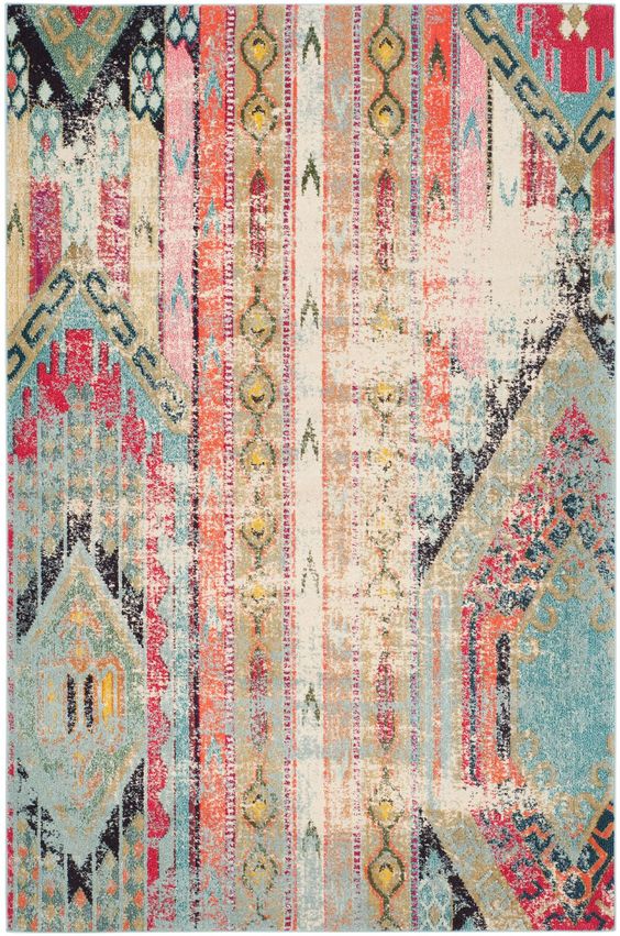 This Safavieh Monaco area rug is our top choice for the room - it ties our color palette together from room to room, has the pre-faded look to hide dog wear and tear, and has a graphic boho pattern that adds the 