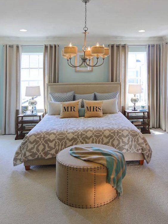 Traditionally found in dining rooms, elegant chandeliers with shades are making their way into new spaces. Refresh your master bedroom design with a classic chandelier above the bed | Credit: Miller & Smith Homes, Jim Kirby Photography