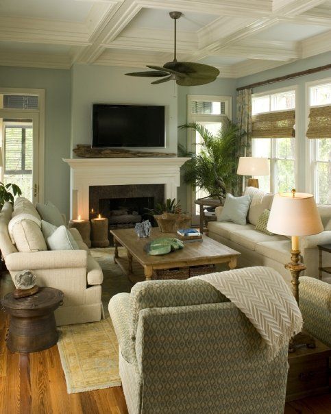 Very pretty light living room - beautiful blue and cream, like the seating arrangement