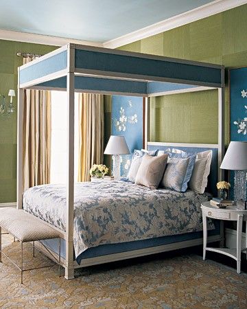 We all like to dream in Technicolor, yet many of us are reluctant to decorate a bedroom in anything but hushed neutrals and restful pastels. This room's unique color combination of teal blue and moss green is bold but beautiful. A floral pattern on the wall decorations, rug, and bedding pulls it all together.