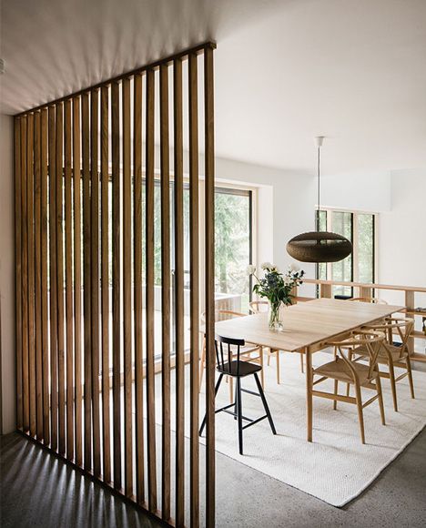 wood divider - Interior shot of Villa Torsby by Max Holst Arkitektkontor in Sweden.