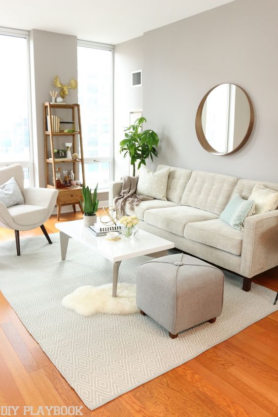 A neutral living room perfect for any city girl! Love the gold accents and quality furniture.