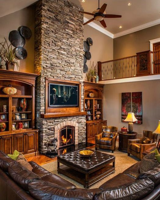 I love the stone fireplace and the cabinets on each side.