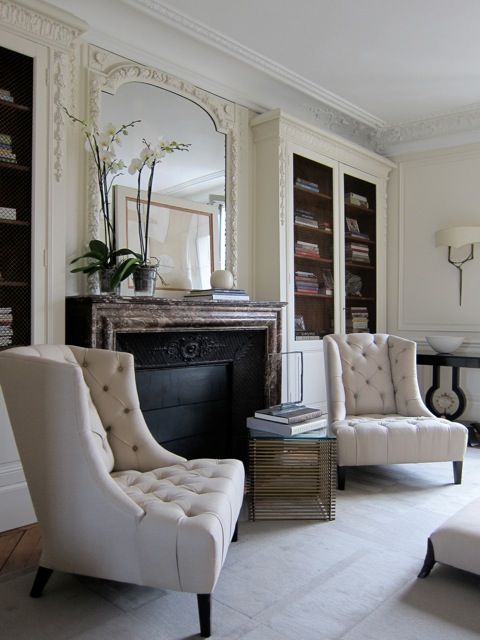 Just beautiful. Ornate trim, layered Mantle decor, gorgeous chairs.