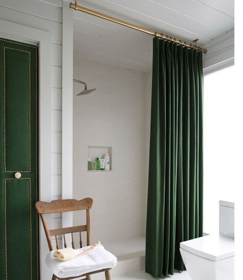 The same basic theory works with your shower curtain, too: Spray-paint a shower rod gold and suspend it from the ceiling. | 40 Easy DIYs That Will Significantly Upgrade Your Home