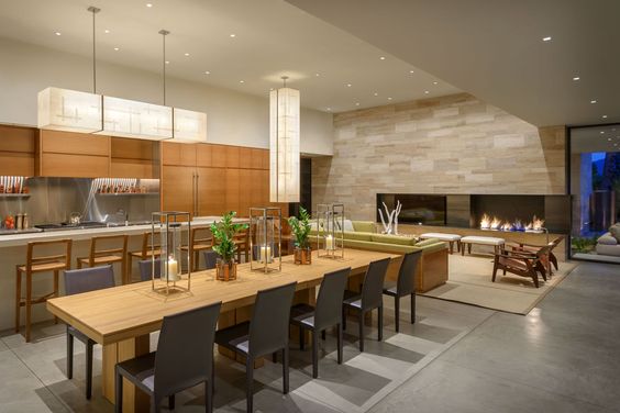 The warm, neutral tones with soft pops of color make this modern desert home really sing. It appeals to me because they've managed that calm, neutral look without using white everywhere. The tone of the wood kitchen cabinets is perfect.