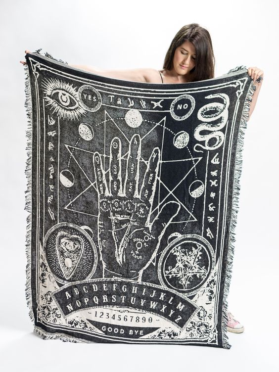 We want to wrap ourselves in this palmistry throw blanket right NOW.