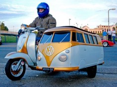 A Lambretta scooter with a custom-built VW campervan sidecar in Northwood, Middlesex. The sidecar was created by scooter fan Jay Dyer for his 11-year-old son Kaine to sit in while they drive around the country.