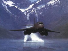 A USAF Rockwell B-1 Lancer supersonic bomber skimming the surface of a lake NOE (Nap Of The Earth)
