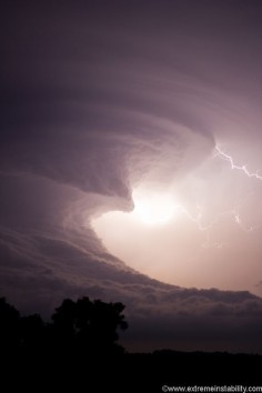 An amazing supercell tracks across southern Nebraska, producing other-worldy storm structures. At times this storm looked like a giant tsunami in the sky. The supercell formed after two supercells merged near McCook Nebraska. It then tracked eastward as one storm till it died after midnight east of Hastings Nebraska. © Mike Hollingshead