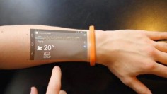 An Android powered smart bracelet forgoes the tiny display of a typical smartwatch and projects a smartphone-size touchscreen onto the skin