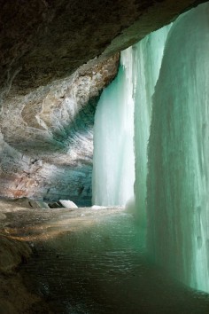 Behind the frozen Minnehaha Falls, a 53-foot waterfall located in Minnehaha Park, Hennepin County, Minnesota, USA