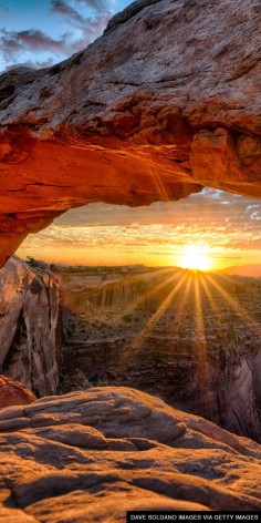 Catch the sunrise from a new vantage point beneath Mesa Arch in Utah