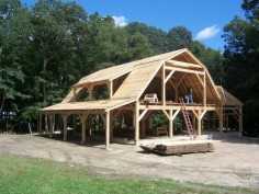 Cordwood frame with gambrel roof - like the structure design of this, smaller for a cabin maybe?
