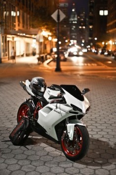 Ducati! If I ever owned a bike I would love to own a ducati! White with black & have maybe blue  not sure but I would love this!