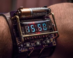 Engineer designs a cyberpunk themed wristwatch using a VFD display tube powered by a single AA battery. Unfortunately, it only runs for a few hours.