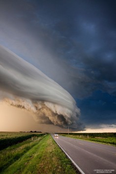 Famous photographer and storm chaser Ryan McGinnis captured these stunning pictures of an arcus cloud that rolled just north of Kearney, Nebraska, on August 7th.  This sweet storm’s amazing appearance is the result of great storm structure and perfect lighting, with the sun going down behind the storm and illuminating the cloud with an orange glow.