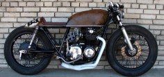 Honda CB750 - Custom Motorcycle. It's a cafe racer but I love the overall shape and character of the bike. Well done.
