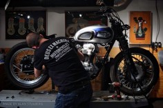 How to buy a motorcycle for your custom project: A scene from the Revival Cycles workshop, with a vintage Triumph. (Good to see revival supporting other shops via their t-shirts too!)