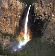 In British Columbia, Canada. No, it is not photoshopped. The photographer said, "The sun has to be in position to get the rainbow, and this photo was not planned by me beforehand. I just happened to be in the right place at the right time." #rainbow #waterfall