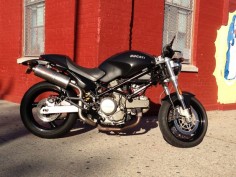 My former bike. 2005 Ducati Monster 620 Dark with high SilMoto exhaust cans.