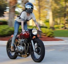 Not just posing with a bike, riding the bike. Fucking sexy. Girl on a cafe racer.
