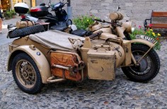 Old Military Motorcycle with sidecar. Is that a BMW symbol on the sidecar fender?