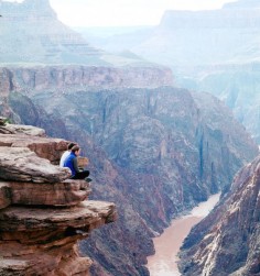 Sitting on the edge of the Grand Canyon is an awesome and awe-inspiring experience.