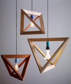 The geometric-shaped Lampframe pendants are made from thin wood strips that are joined together to form triangular frames. The overall shape is formed when four of those frames are connected and then clamp around the lamp cord with the aid of magnets. Made by German designer Herr Mandel, the lights are not about hiding the bulb but rather showcasing it, as you would a picture in a frame.