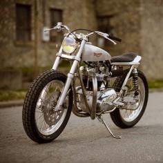 This classic Triumph racer features a hot '67 motor in a rare Trackmaster frame. Built by master craftsman Clay Rathburn of Atom Bomb Custom.
