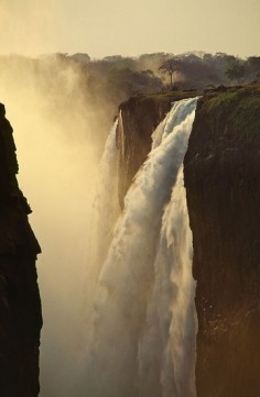 Victoria Falls ("the Smoke that Thunders") is a waterfall in southern Africa on the Zambezi River at the border of Zambia and Zimbabwe.