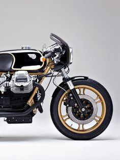 Which famous 1970s Formula 1 race team livery does this Moto Guzzi Le Mans custom remind you of ..?