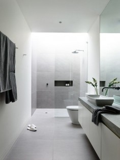 12 Design Ideas For Including Built-In Shelving In Your Shower // A long built-in shelving compartment in this shower, is a great place to store shower gels, shampoos, and conditioners.