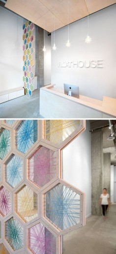 19 Ideas For Using Hexagons In Interior Design And Architecture // A 17 foot tall screen made from birchwood hexagons woven with colorful twine greets you as you enter the FloatHouse in Vancouver.