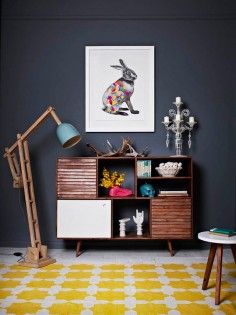 A deep, rich, charcoal gray creates the perfect backdrop for anyone with eclectic style. Without a bright wall color to divert attention, found or refurbished objects can become the room's focal point—inviting visitors to explore more closely.