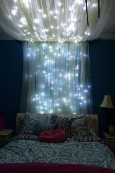 Add some string lights to create an extra whimsical effect. | 14 Dreamy DIY Canopy Beds That Will Transform Your Bedroom