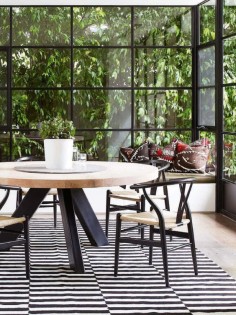 Amazing windows and lovely contrasting round dining table