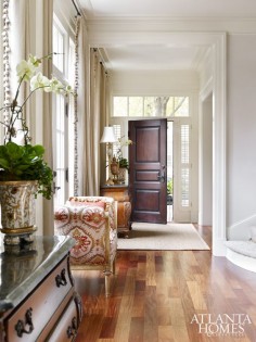 Architect Jim Strickland, founder of Peachtree City-based Historical Concepts, worked with Marcia and Mike Taylor to fashion a home ideal for entertaining. Classical moldings, a raised panel door, and large windows make a strong architectural statement in the foyer.