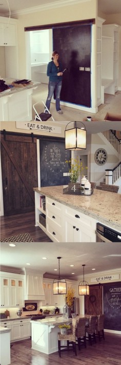 Awesome antique barn door and chalkboard wall in Yellow Prairie Interiors' kitchen! You can easily hang a door like this with box rails and metal hangers -- click to buy all the hardware