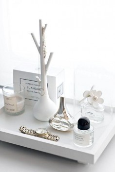 Beauty Product Organization: 10 Chic Ways to Decorate Your Vanity - perfumes on a white tray with decorative objects, candles, and jewelry