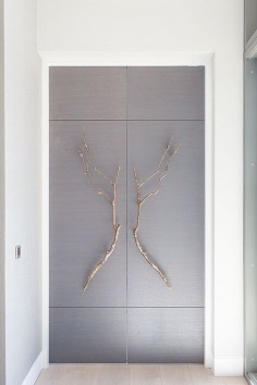 Bespoke doors with bronze branch handles. Design by Stephenson Wright.