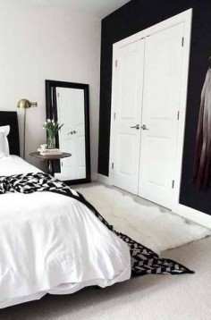 black accent walls black and white bedroom