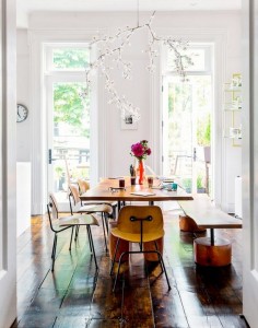 Bright dining space with bench seating and a wood table