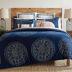 Bring a Bohemian look to your bedroom with the artsy Trina Turk Costa Mesa Medallion Comforter Set. Decked out in white and blue printed painterly medallions, the deep indigo bedding is a whimsical addition to any room's décor.