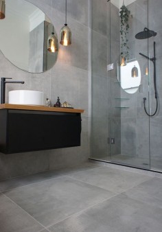 Cat & Jeremy's main bathroom, they used a large format tile called Cementia Grey 75